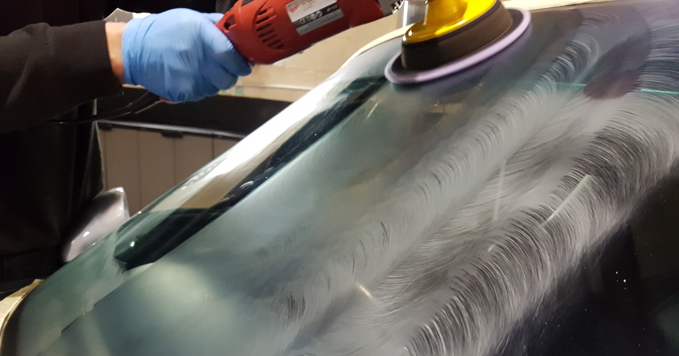 The key to ensuring your glass coating performs is in the prep stages - here James of Cheshire Auto Detailing is polishing a windscreen in advance of applying a Nanolex coating