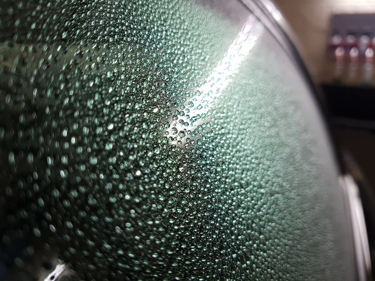 The beading effect that a glass sealant will produce on glass